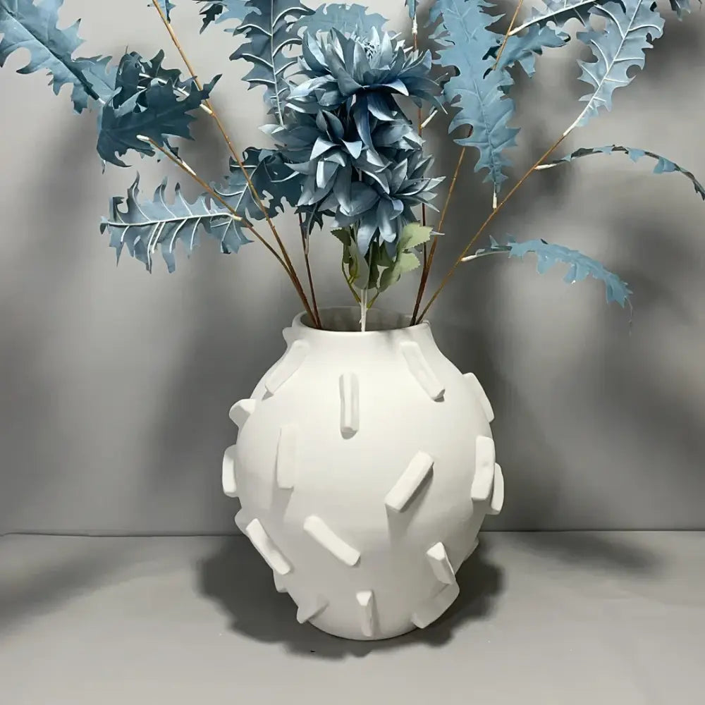 White ceramic geometric block vase with rounded body and rectangular ridges for decorbites geometric block living room decor