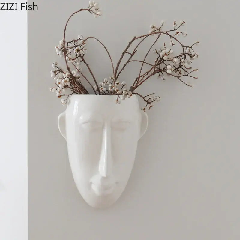 White ceramic vase with abstract human face design by decorbites for minimalist wall decor in living room