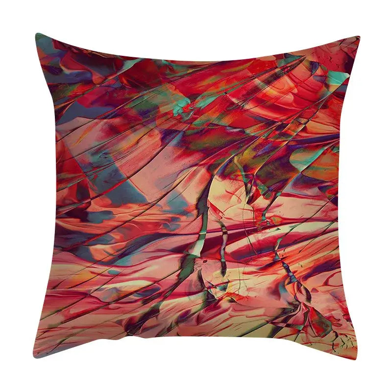Vibrant abstract ink marbling cushion cover with swirling red pink teal and orange hues on textured fabric decorbites abstract ink throw pillow