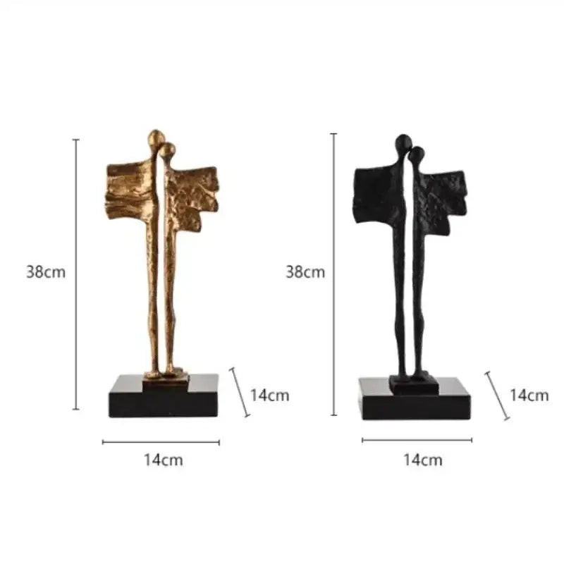 Two abstract iron cast couple statues in gold and black with textured wing-like forms for living room decorbites decor