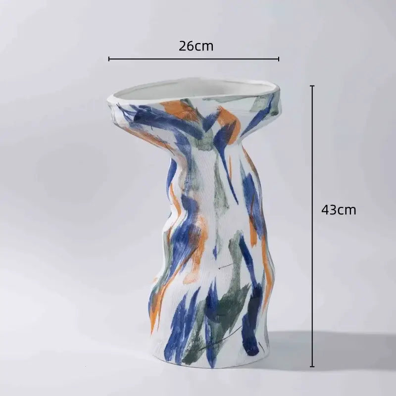 A tall abstract irregular ceramic vase set with bold blue orange green and white brushstrokes for living room decorbites decor