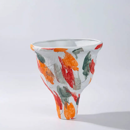 White ceramic abstract irregular vase set with flared rim and bold orange red green brushstrokes for living room decorbites decor