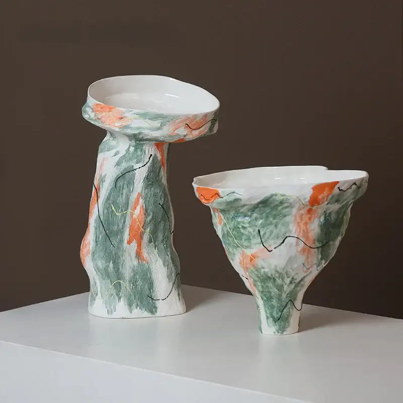Two hand-painted ceramic vases with abstract irregular pattern in green and orange for living room decor