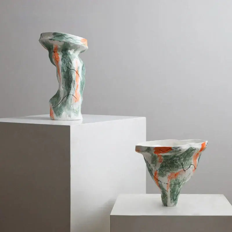 Abstract irregular pattern ceramic vase with textured organic form in green and orange glazes for living room decor