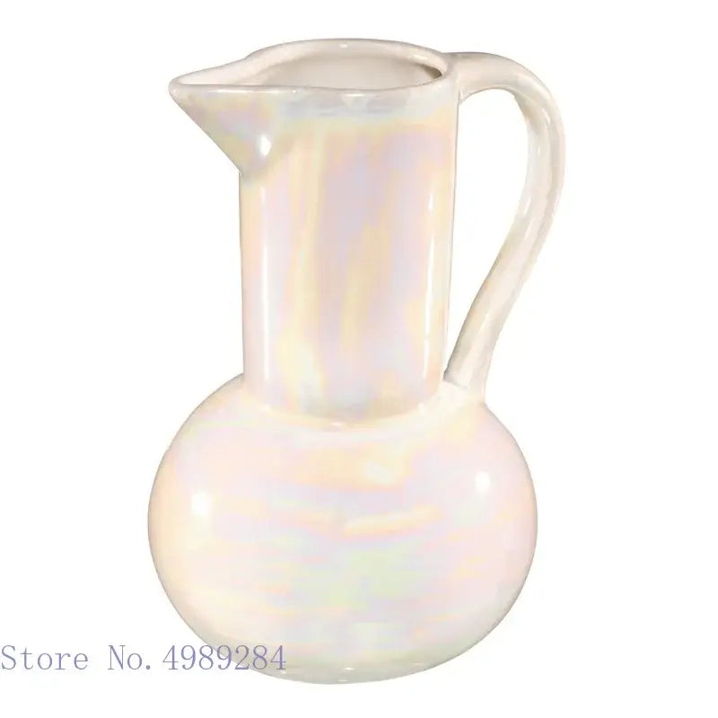 Iridescent white decorbites ceramic shell vase with rounded base and curved handle for living room decor