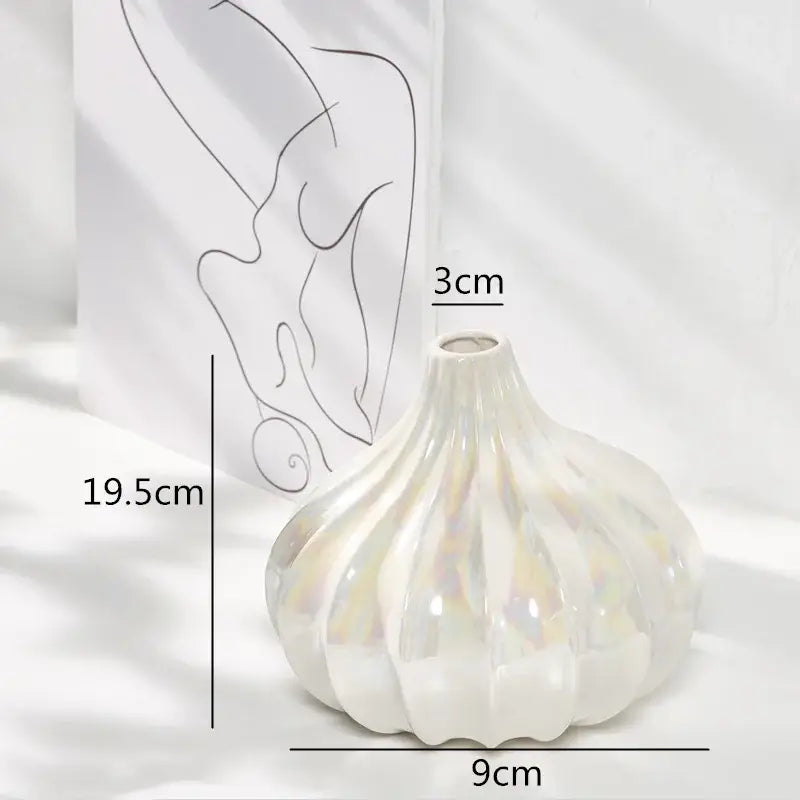 Glossy white decorbites ceramic shell vase with fluted segmented design and iridescent glaze for living room decor