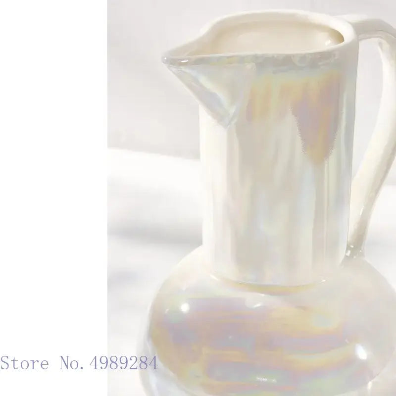 Abstract irregular white ceramic shell vase with a glossy iridescent finish for living room decor by decorbites ceramic shell
