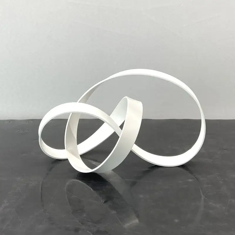 White minimalist abstract knot sculpture made of smooth interlocking rings for decorbites abstract knot decor