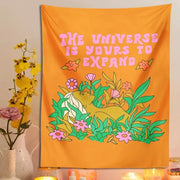 Vibrant orange decorbites abstract landscape flower tapestry with stylized figure and pink lettering for bedroom wall hanging