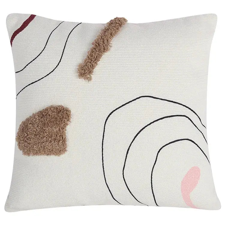 Cream cushion cover with abstract line colors design featuring black stitched lines brown tufts and pink accent for decorbites decor