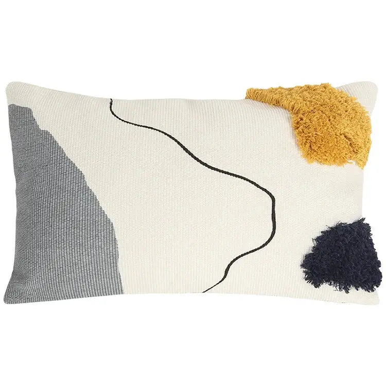 Cream-colored cushion cover with decorbites abstract line design featuring gray panel and mustard navy tassels for living room