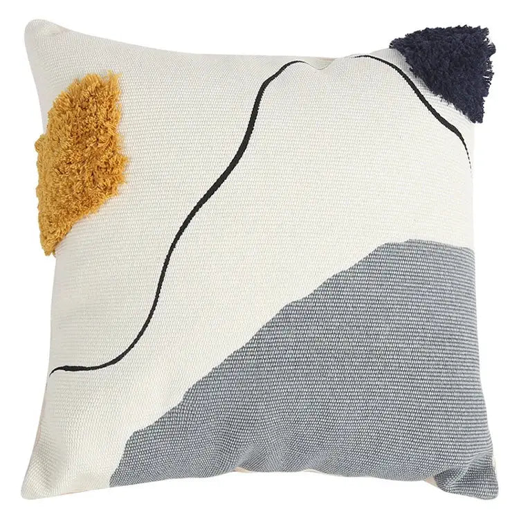 Cream-colored cushion cover with abstract line colors design in gray black and textured mustard navy tassels decorbites abstract line