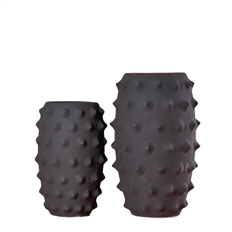Black ceramic sea urchin vase with textured spiky surface by decorbites ideal for living room decor