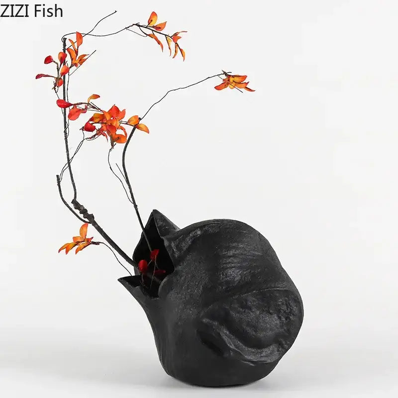 Abstract artwork black ceramic vase shaped like a sleeping cat with orange and red flowers for living room decorbites black vase