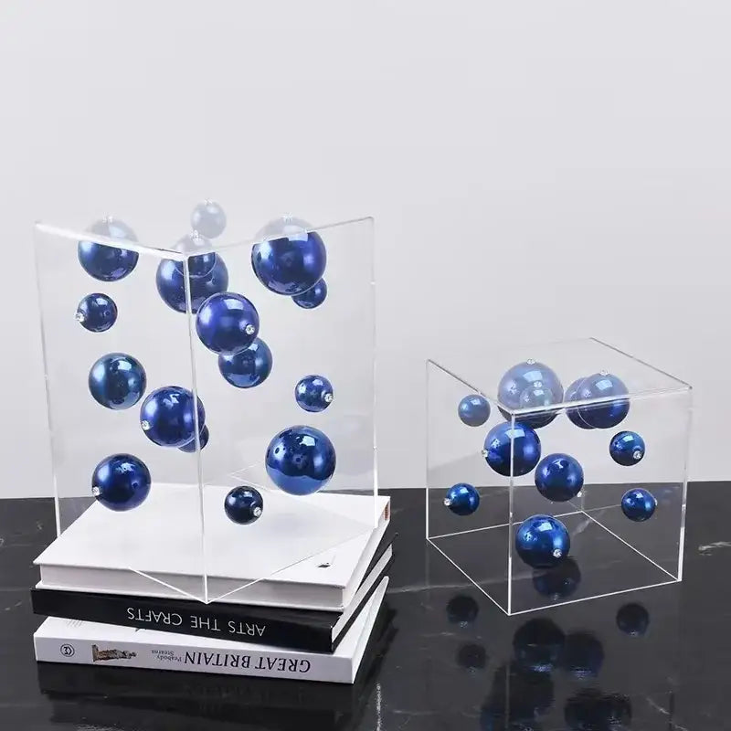 Clear acrylic cube displaying blue glass ornaments for decorbites abstract metal ball artworks living room decor