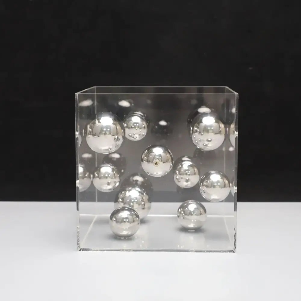 Clear acrylic cube filled with reflective silver spheres as abstract metal ball artworks decorbites red and blue living room decor cube
