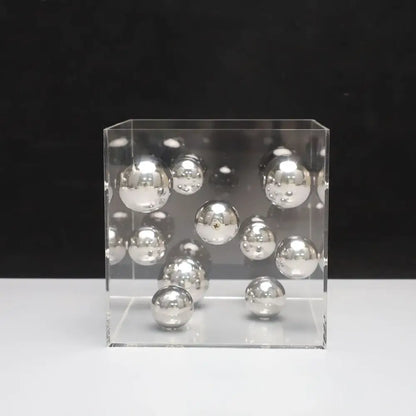 Clear acrylic cube filled with reflective silver spheres as abstract metal ball artworks decorbites red and blue living room decor cube