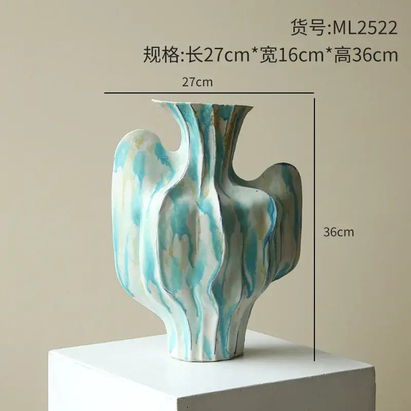 Abstract mint and olive ceramic vase with flowing turquoise white glaze and abstract irregular folds for living room