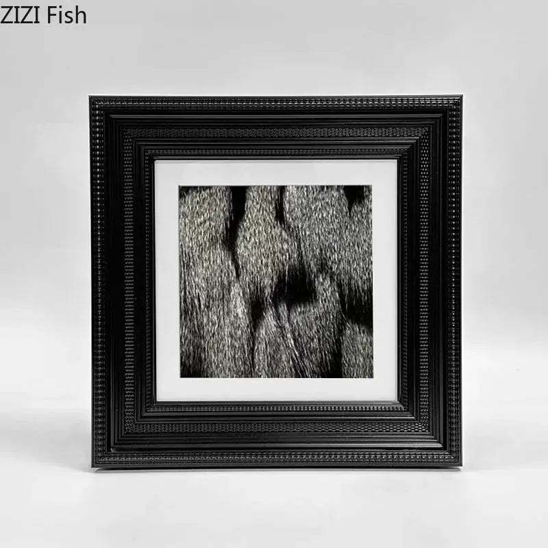 Black ornate picture frame with beaded border holding black and white fur photo for decorbites abstract modern wall art