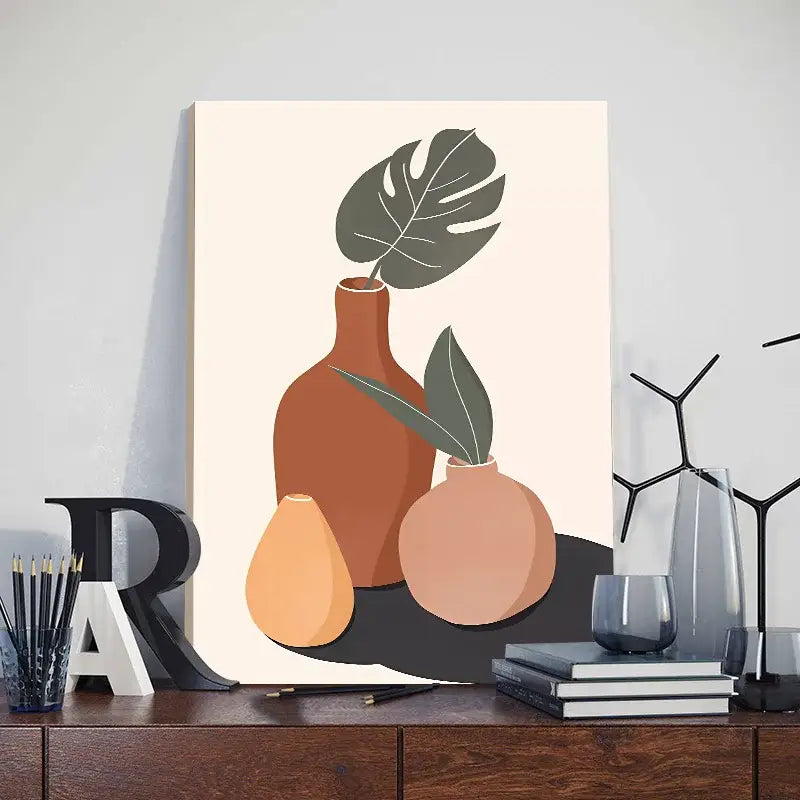 A minimalist canvas print from decorbites™ featuring abstract orange leaf posters with terracotta vases and monstera leaves