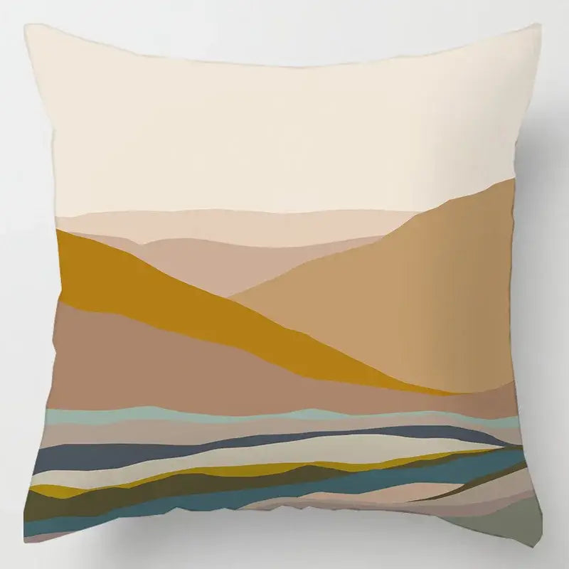 A square cushion cover with geometric leaves print featuring layered beige, ochre, brown, and soft teal tones
