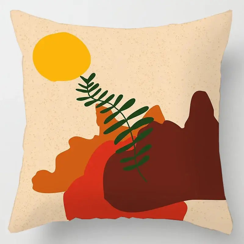 Beige cushion cover with geometric leaves print featuring bold orange, red, dark brown shapes and green leafy branch