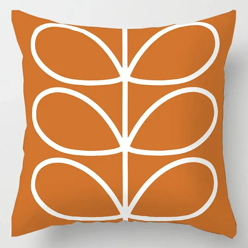 Orange throw pillow with white stylized geometric leaves print cushion cover for living room decor