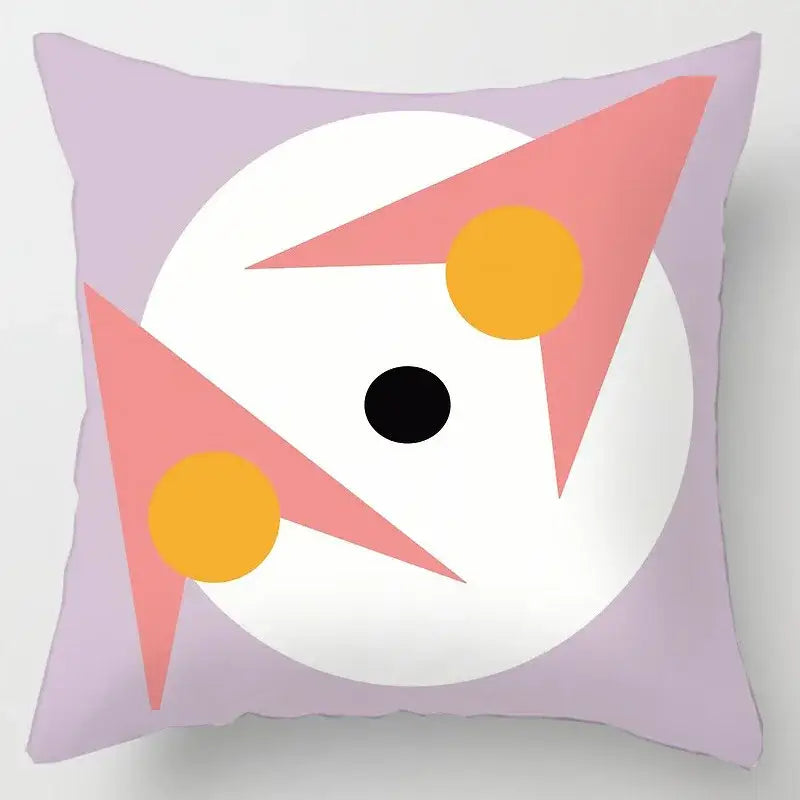 Lavender cushion cover with bold geometric leaves print featuring pink triangles and yellow circles for living room