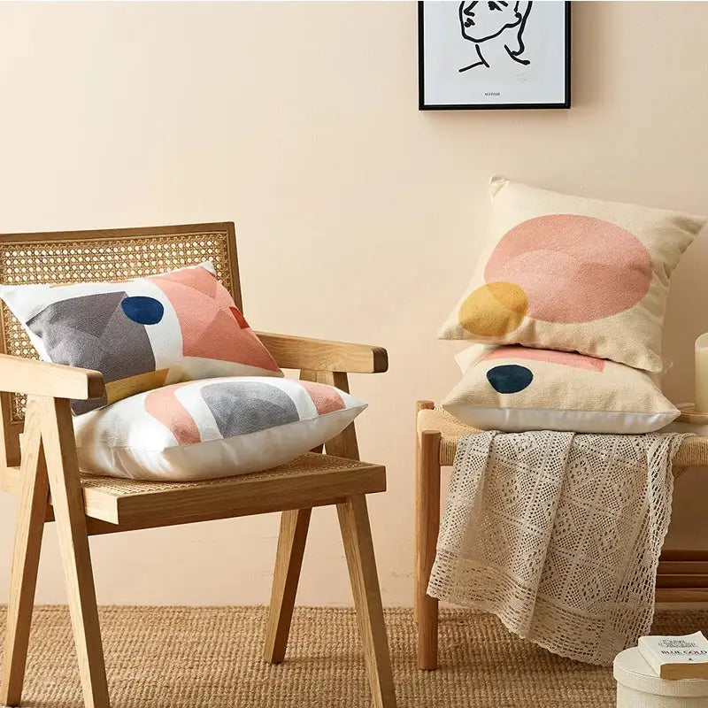 Beige cushion cover with abstract pastel geometric design in pink gray and mustard yellow for decorbites geometric cushion decor