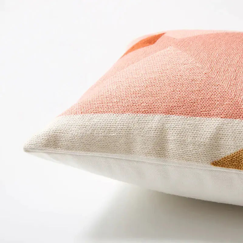 A soft peach and cream pastel geometric cushion cover with textured woven fabric for living room decorbites geometric cushion