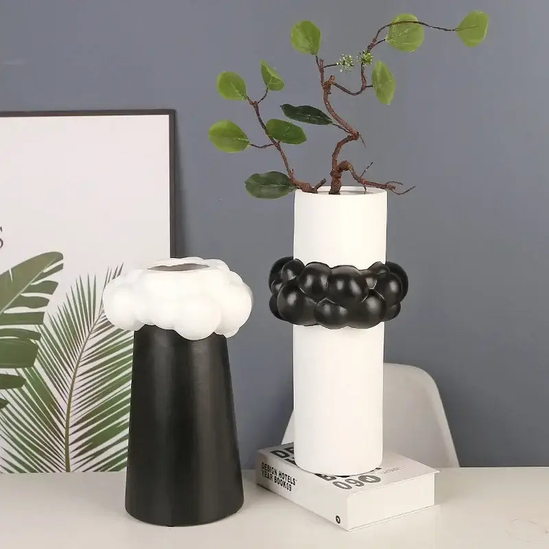 White ceramic abstract patchwork vase with black spherical band and green foliage for living room decorbites abstract patchwork decor