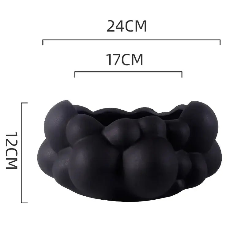 Black matte-finished ceramic planter with bubbly organic design for abstract patchwork ceramic living room decorbites abstract patchwork