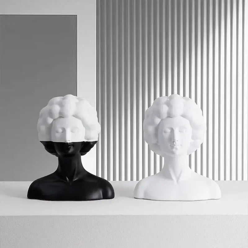 Two minimalist black and white abstract portrait resin figure bust sculptures with stylized curly hair for living room decor