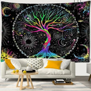 Abstract tree of life tapestry wall hanging with vibrant rainbow colors and celestial motifs above white sofa