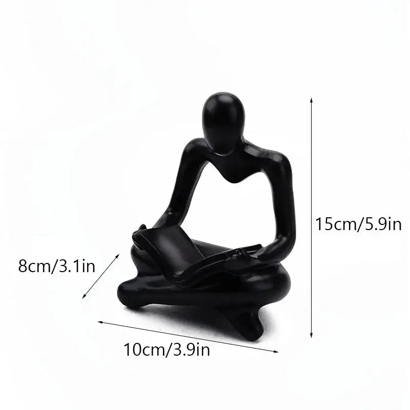 Black glossy resin book figurine of a seated human reading for decorbites abstract resin office decorbites abstract resin decorbites abstract resin office decor