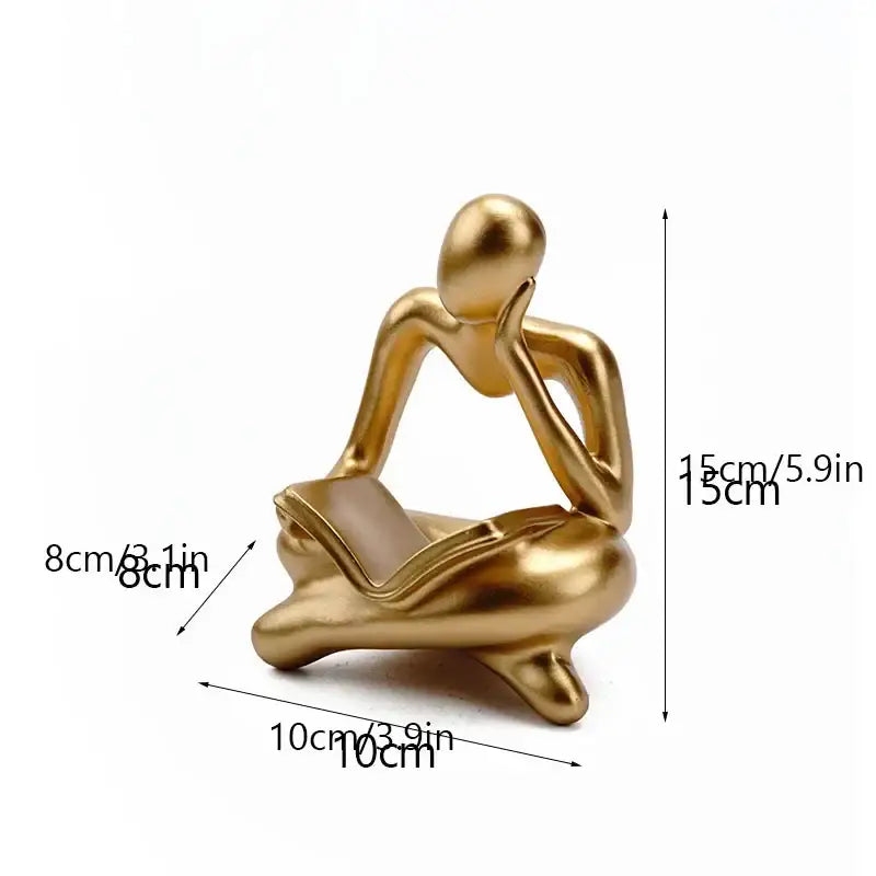 Golden metallic resin book figurine of a seated thinker holding a book for decorbites abstract resin office decorbites abstract resin