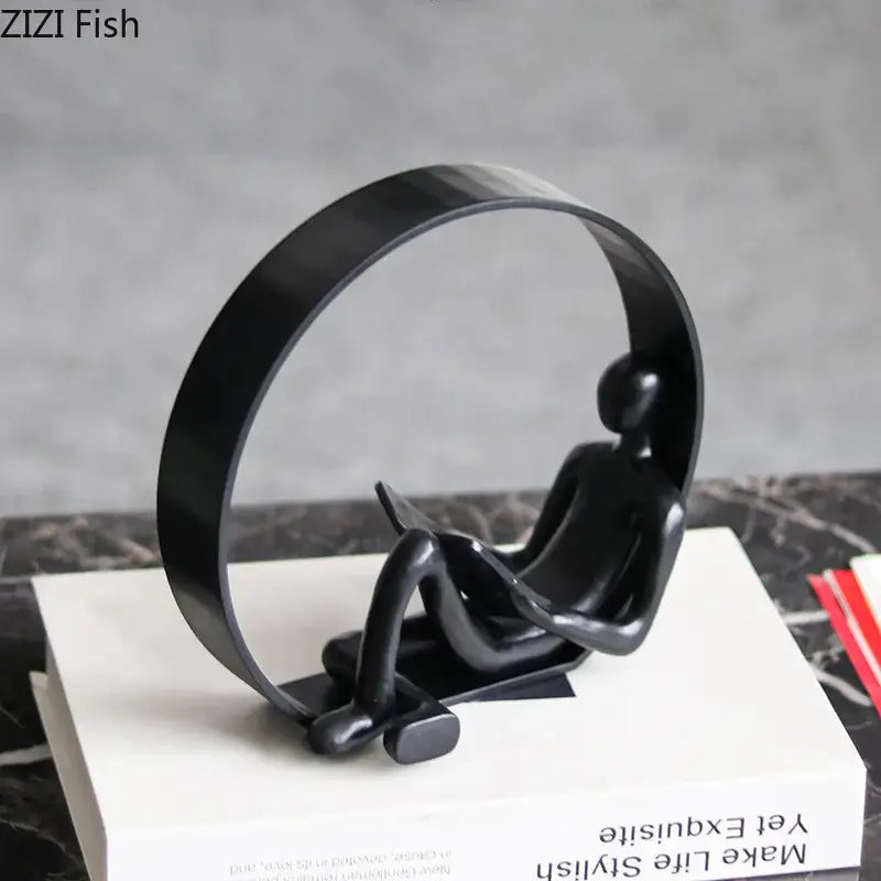 Black glossy resin abstract resin characters figurine of seated human reading under arch for home decor by decorbites