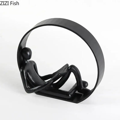 Black matte abstract resin characters figurine seated within circular frame for home decor and decorbites abstract resin collection