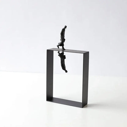 Black metallic abstract resin sculpture of a man walking on a frame with inverted reflection for living room decorbites decor