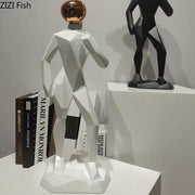 Abstract resin sculpture of a white geometric human figure with a rose gold spherical head for resin sculpture room decorbites