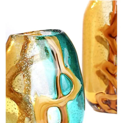 A vibrant hand-blown abstract ripple glass vase with swirling amber and teal patterns for living room decor