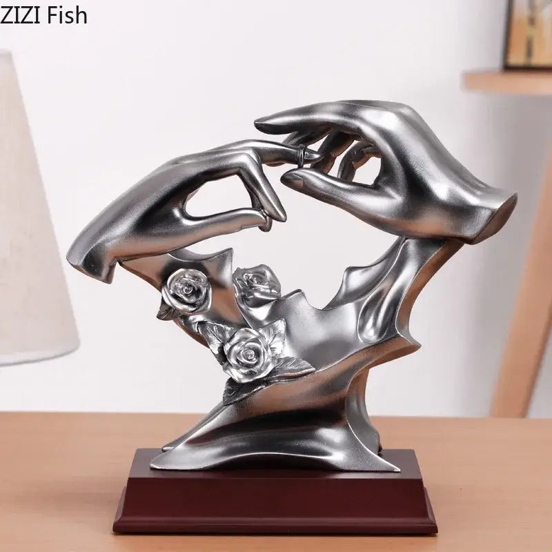 Silver resin decorbites couples rings statue featuring two hands holding a ring with three rose blossoms base