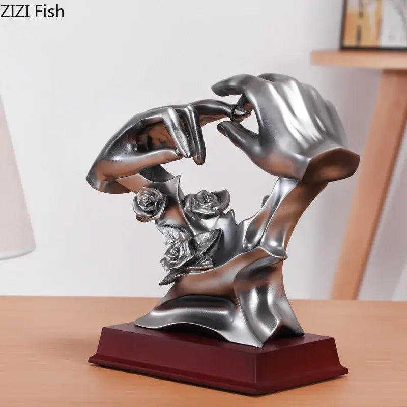 Silver resin couples rings statue with hands holding ring above roses on dark red wooden base for rings statue desk decorbites