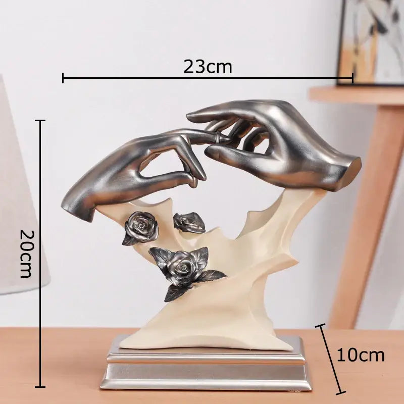 Silver-toned abstract couples rings statue with two hands and metallic roses on cream base for rings statue desk decorbites couples rings