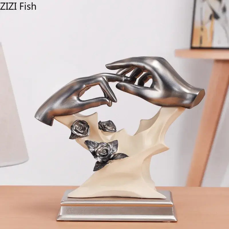 Silver-toned resin couples rings statue with intertwined hands and embossed roses on cream base for rings statue desk decor