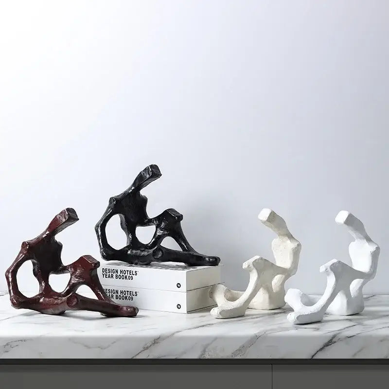 Black abstract skeleton decor figure sculpture with organic flowing forms and matte finish for living room bookends