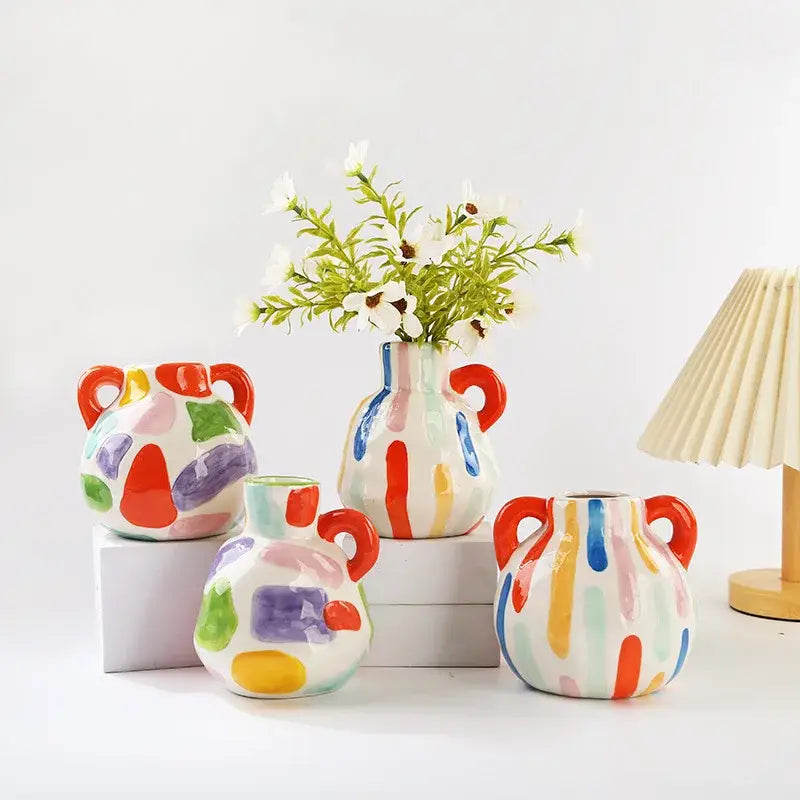 Colorful ceramic vase teapot with red handles and abstract paint splatter design for decorbites cartoon ceramic decor