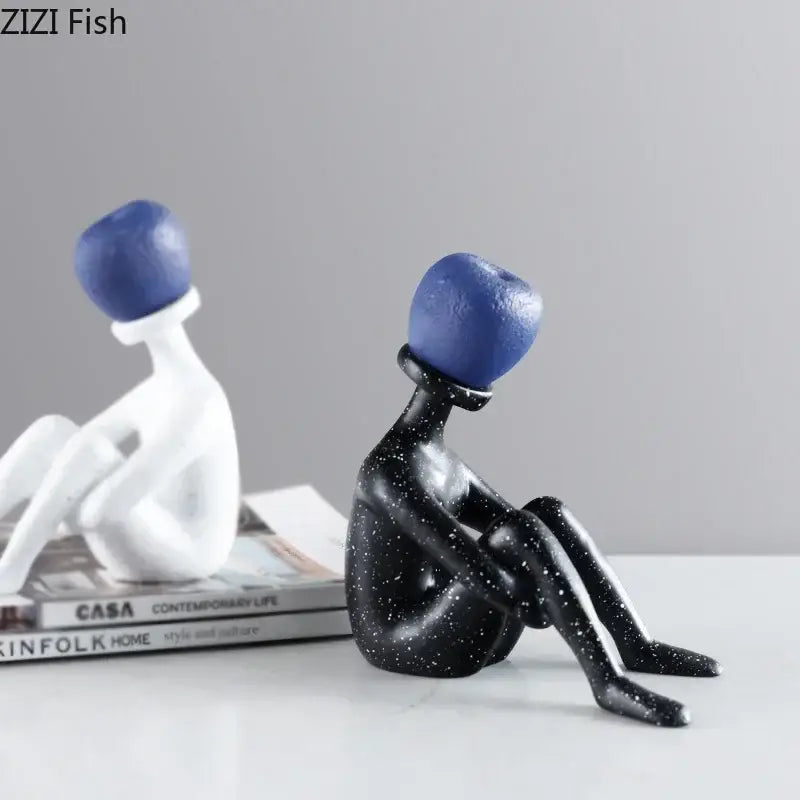 Abstract thinker resin black and white figurine with blue spherical heads crafted from glossy resin for living room decor