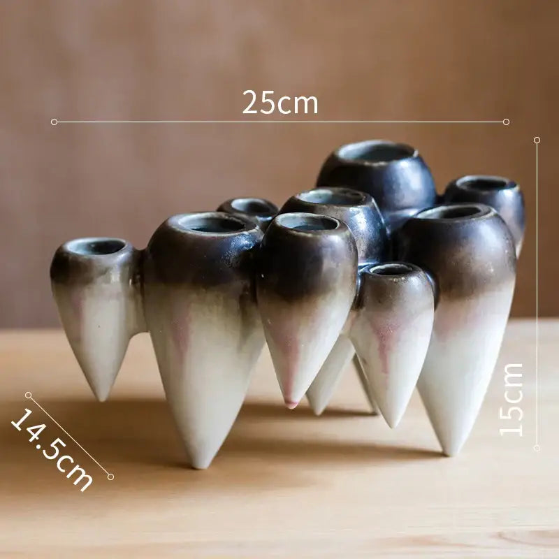 A cluster of ceramic abstract tooth hanging vases with blue and green gradient glaze for decorbites abstract tooth decor