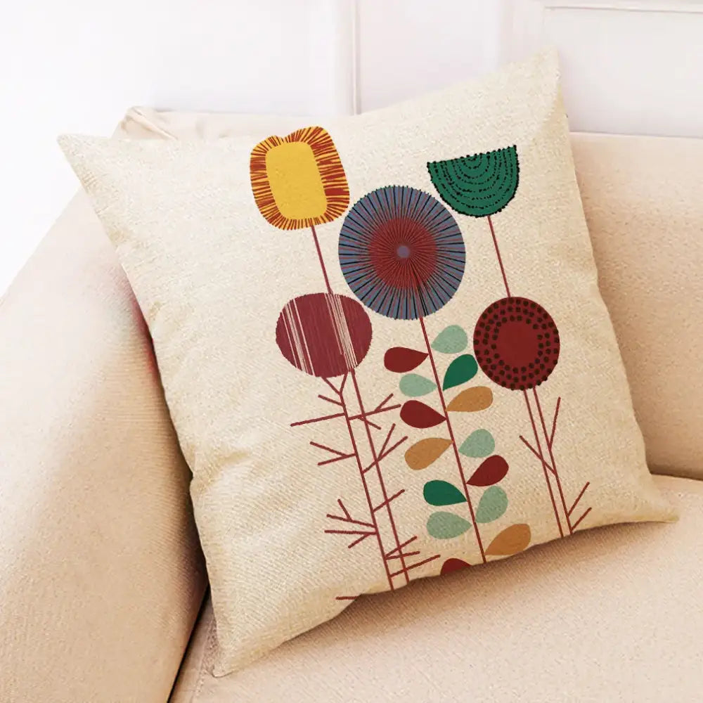 Beige linen pillow cover with embroidered abstract tree flower design in yellow green blue and red for living room decorbites